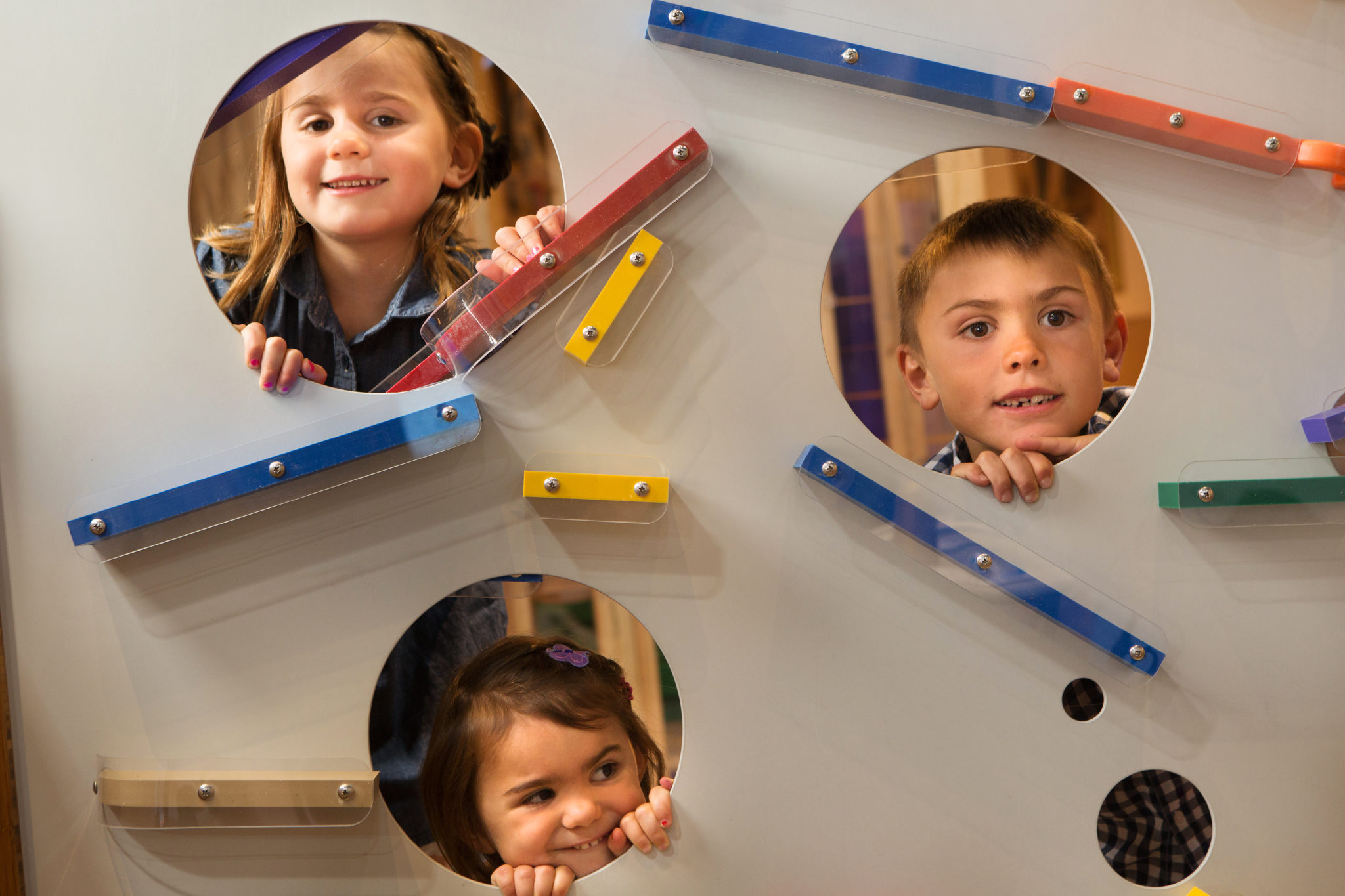 kids playing at magnetic ball wall