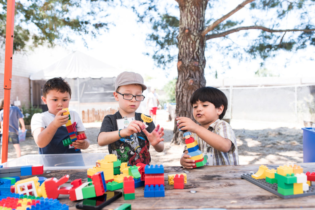 two children playing with blocks at wonder camp