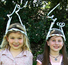 kids wearing pipe cleaner bug antennae