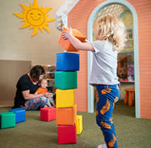 child stacking blocks