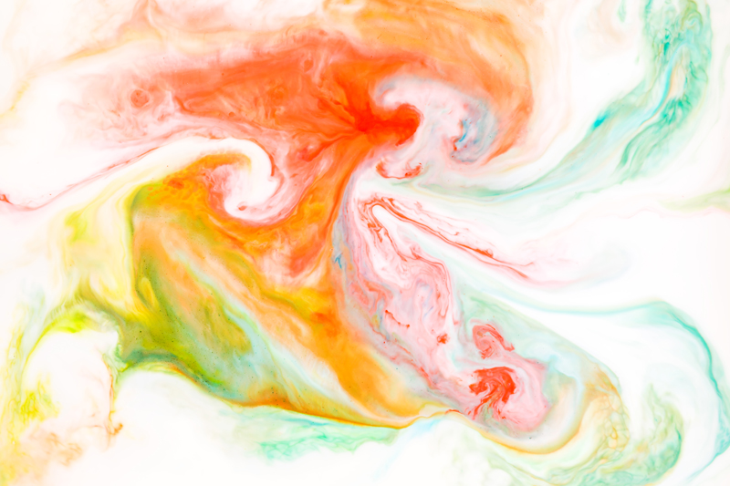 food coloring colors swirled around in milk