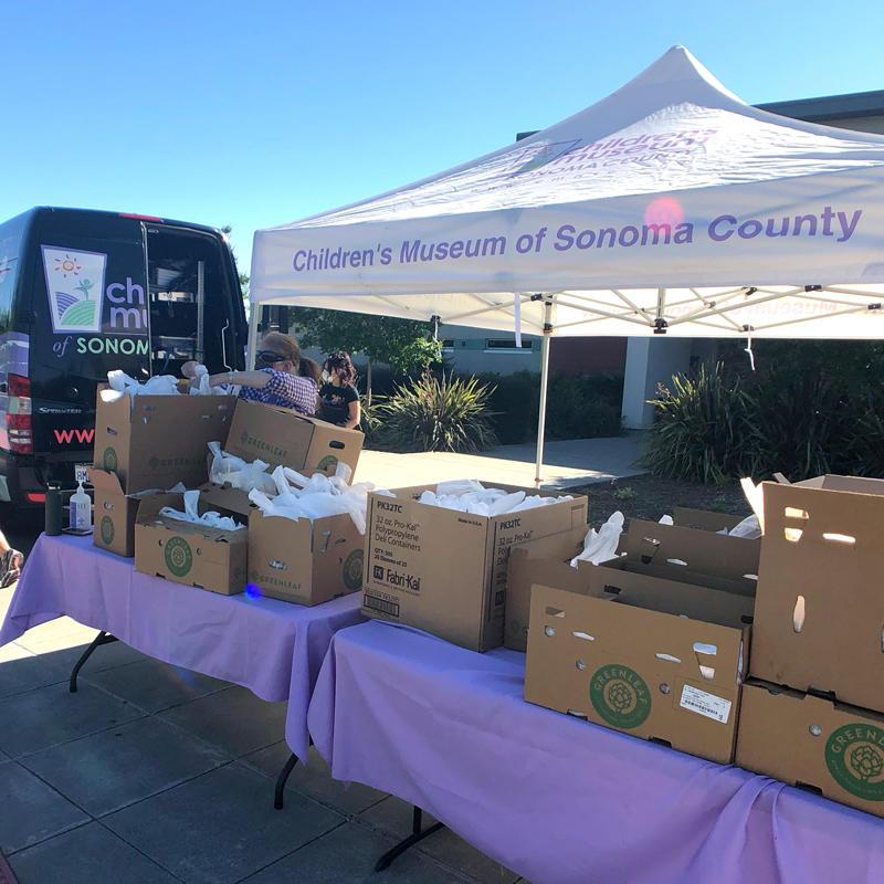 boxes of meals being loaded into vehicle