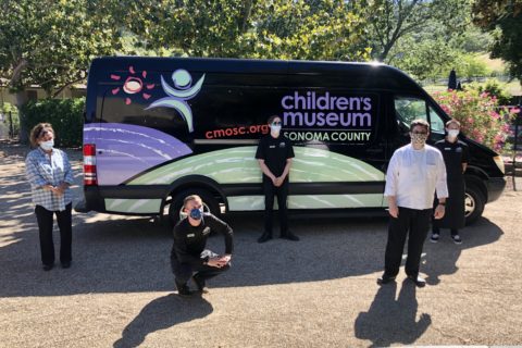 volunteers standing in front of van