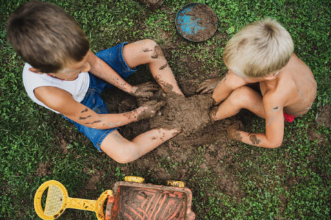 overhead view of kids playing in mud