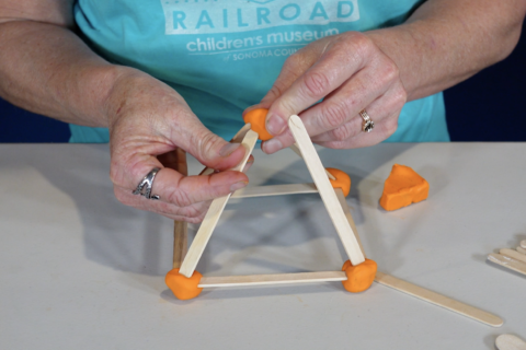 a 3D shape handmade out molding clay and craft sticks from the Children's Museum of Sonoma County's Creative Construction kit and caboodles