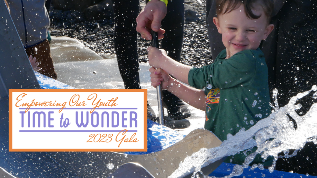 children playing with outdoor water exhibit at the Children's Museum