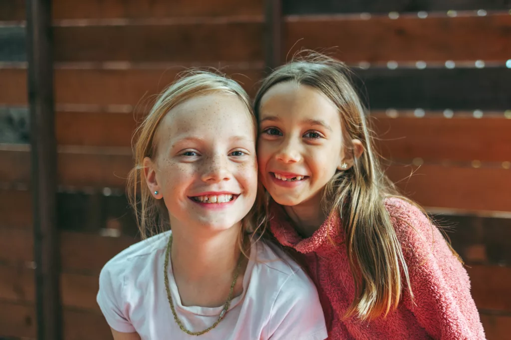 two girls smiling