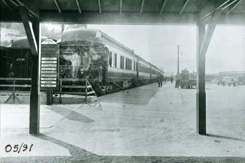Sonoma County train depot; sign for Track 5 lists Ignacio, Novato, Petaluma, Santa Rosa, Healdsburg, Cloverdale, Hopland, Ukiah, and Willits. Northwestern Pacific observation car, handcarts and various railroad tracks.